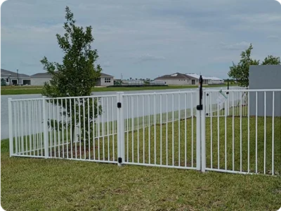 Black aluminum decorative fence around pool area in Treasure Coast home